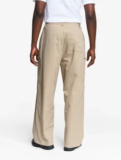 Le pantalon mixte ample Aigle Experience by Études - Beige