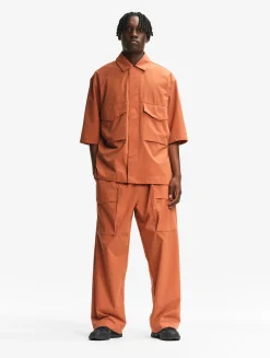 Le pantalon mixte ample Aigle Experience by Études - Orange