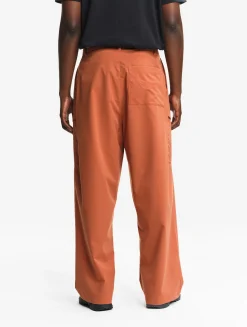 Le pantalon mixte ample Aigle Experience by Études - Orange